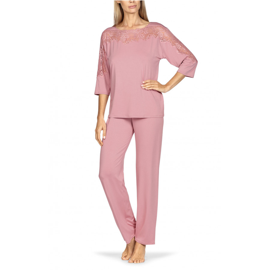 Two-piece pyjamas comprising a top with lace-trimmed boat neck and long trousers. Coemi-lingerie