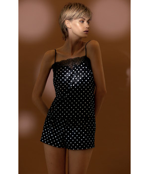 Two-piece nightset comprising a polka dot pattern satin and lace top and shorts.
