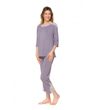 Two-piece pyjamas with three-quarter-length sleeves and three-quarter-length bottoms, and a slash neck enhanced with lace